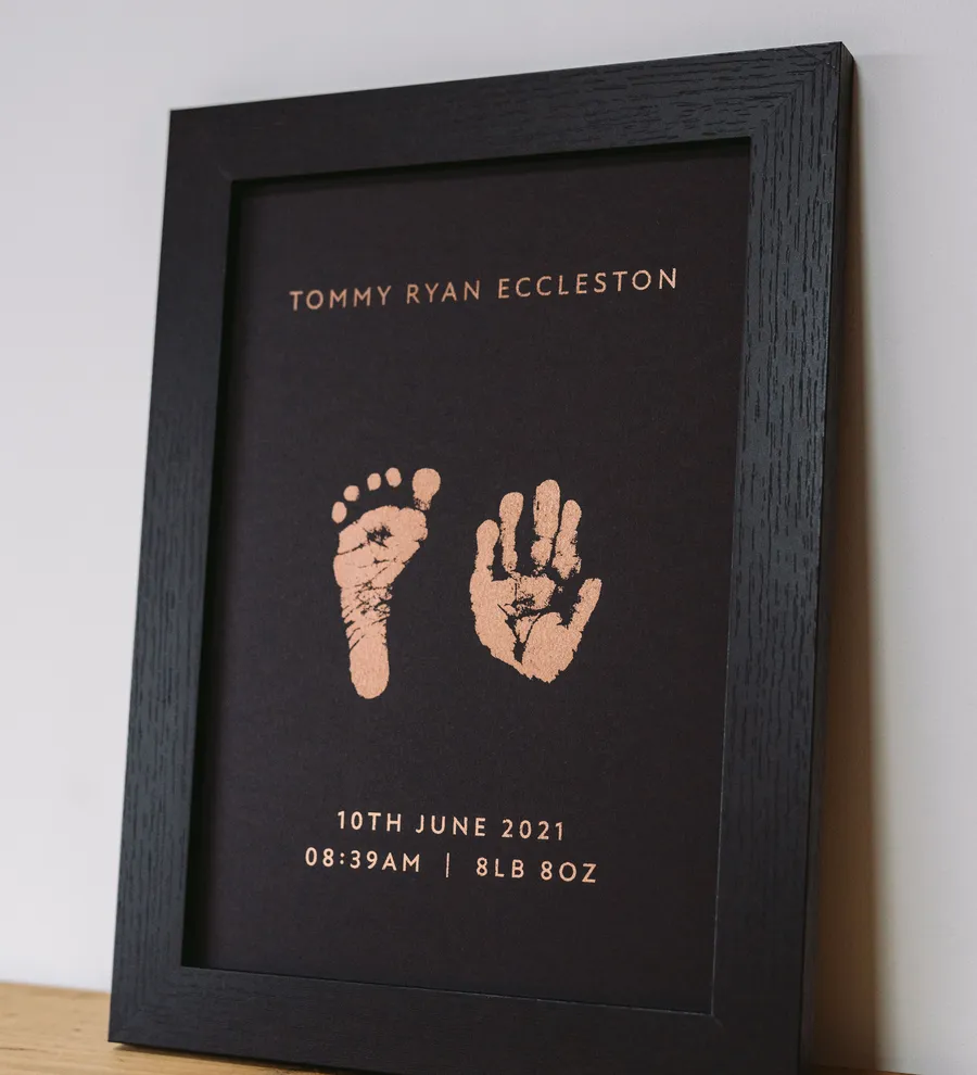 Framed foil hand and footprint keepsake with name, date, time and weight